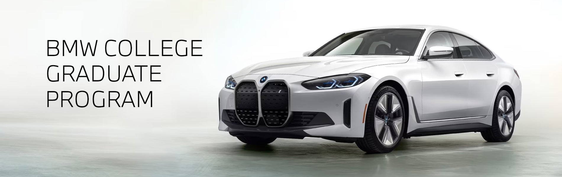 White BMW i4 parked. BMW College Graduate Program. | BMW of Springfield in Springfield NJ